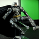 The capes on both figures have wire running through the sides, allowing for basic poseability. This shot looks like something out of The Dark Knight Returns To Mike Fahey’s Ikea Shelving.